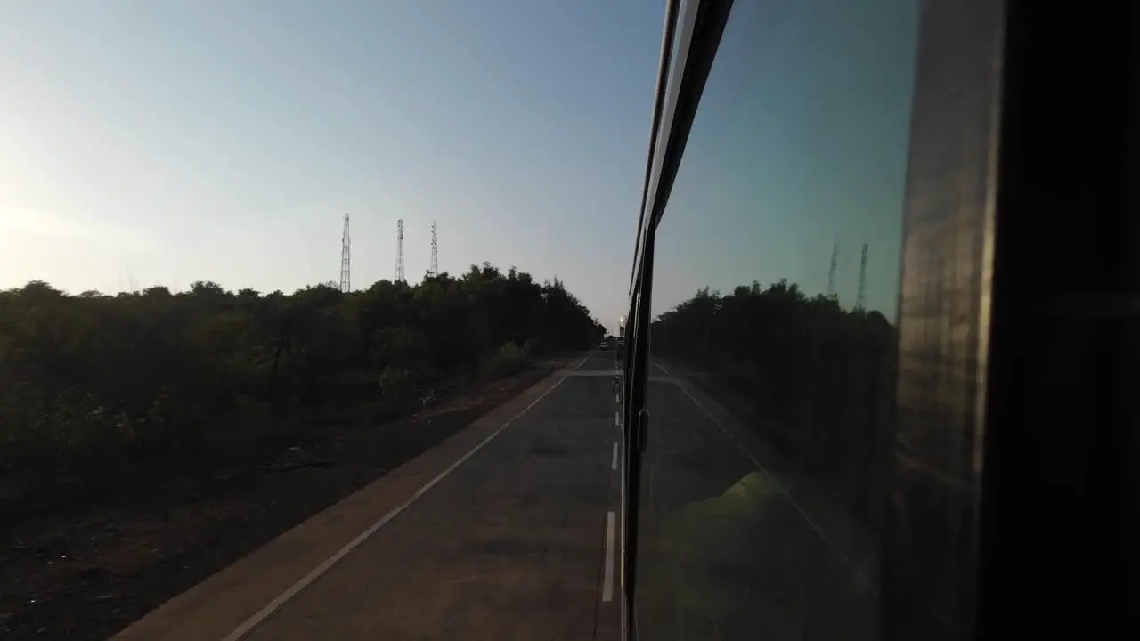 travelling mumbai to Malvan wide view from bus window in evening sunset