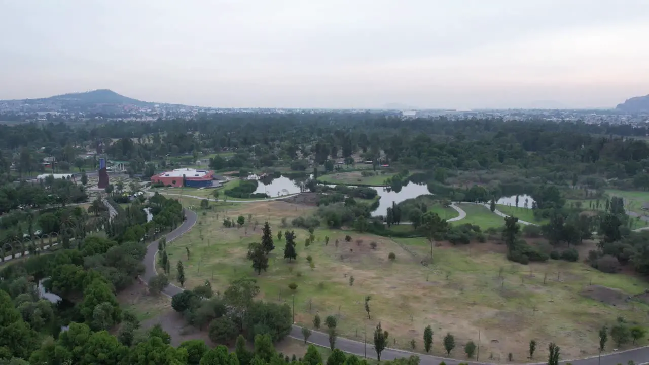 Orbital hyperlapse around a lake with view of a highway and a natural area in Xochimilco Mexico City