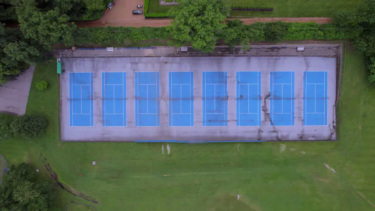 Overhead view of tennis courts with a descent