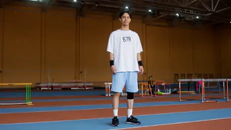 Young man in running track