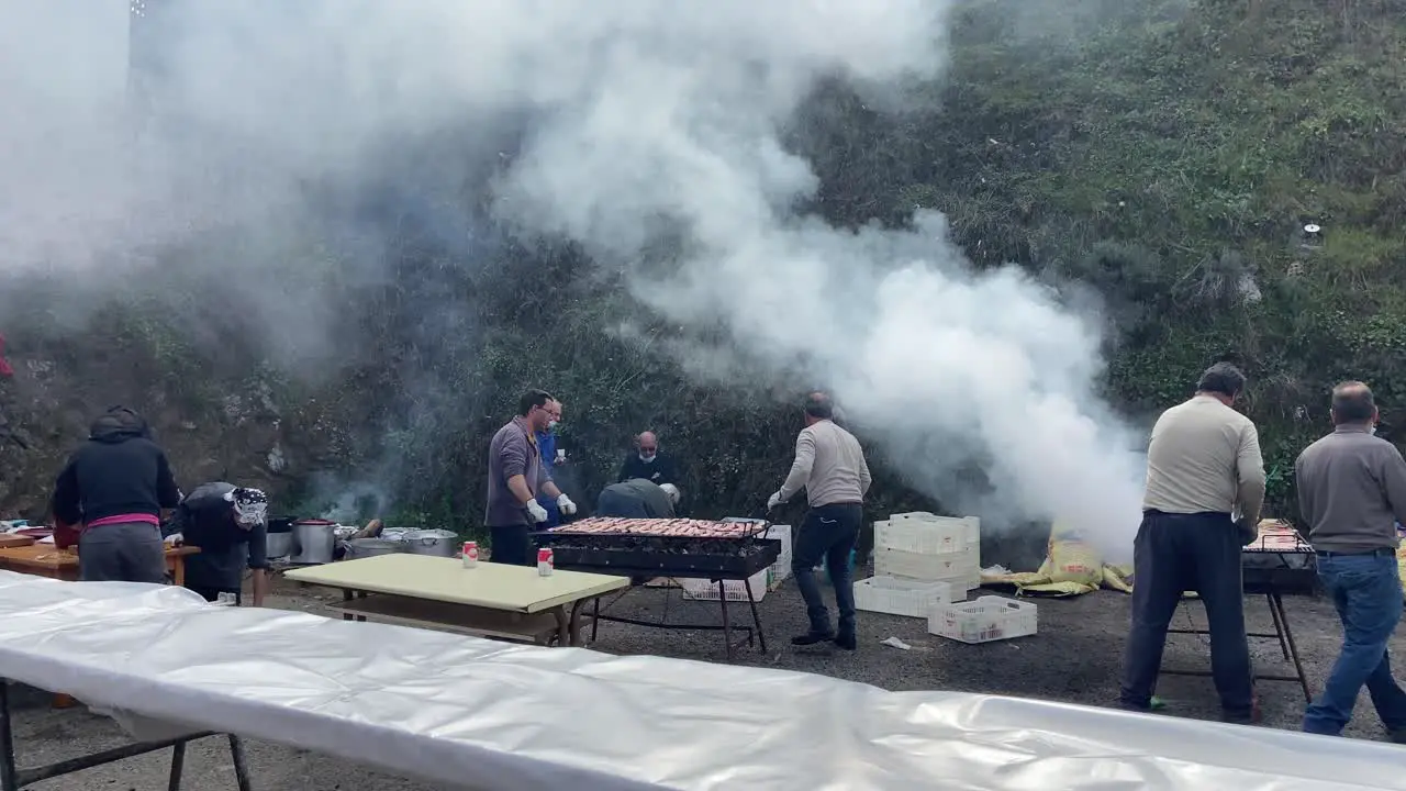 Traditional village people grilling a great barbecue after the popular pig slaughter feast