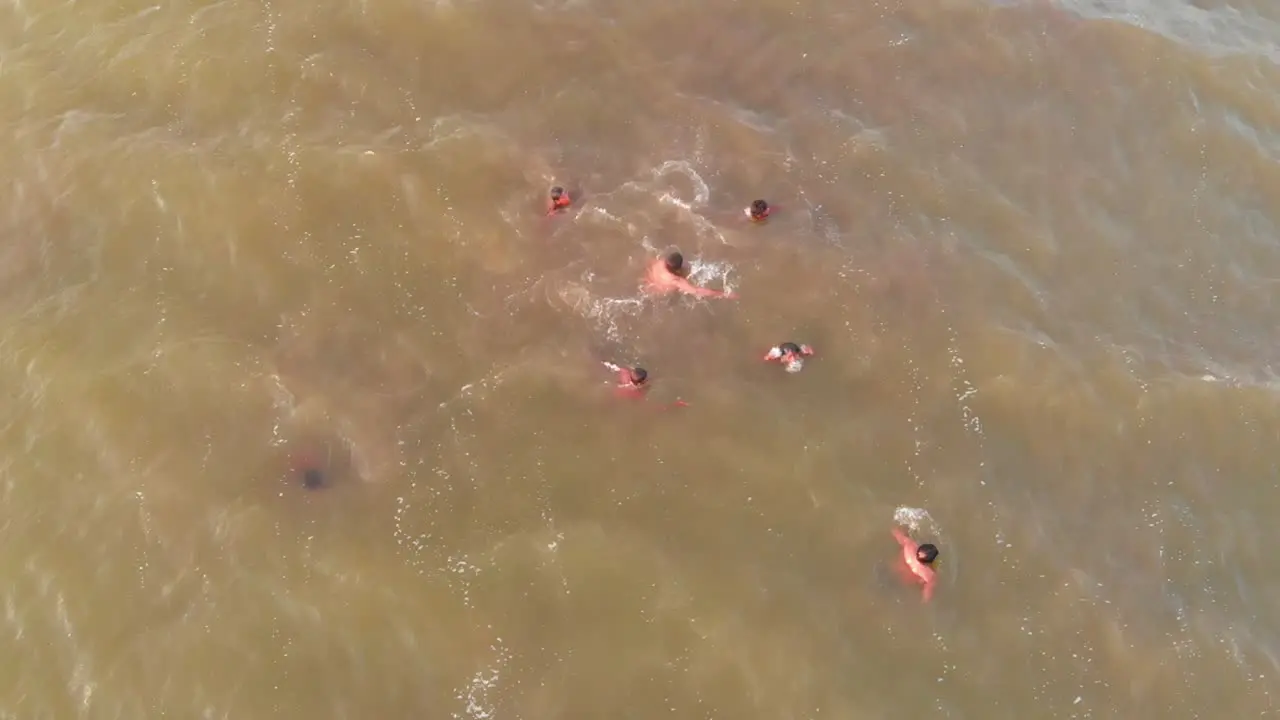 Aerial Birds Eye View Of Male Rescuers Swimming For Flood Rescue Training In Balochistan In The Arabian Sea