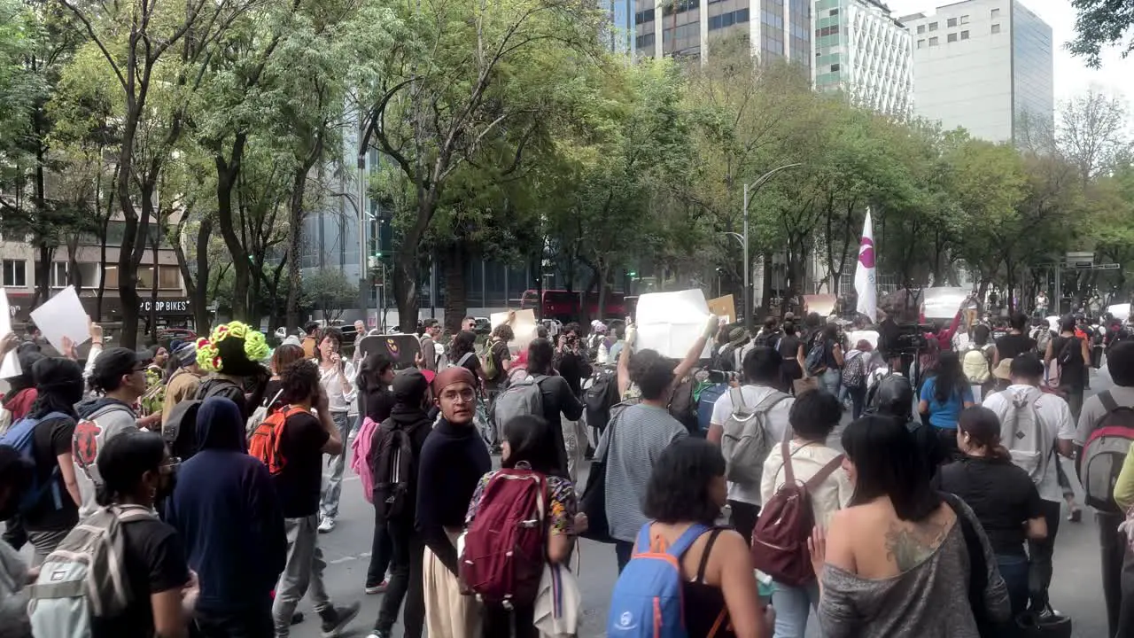 shot of a social protest in mexico city at main avenue