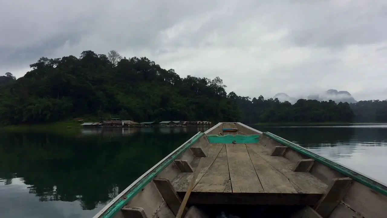 Sailing towards a floating houses park in the middle of summer to stay there for a few nights in a beautiful landscape