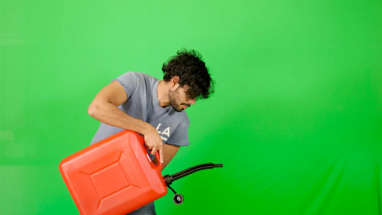 Indian gut carrying heavy petrol container with green screen green background