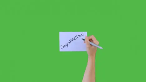 Woman Writing Congratulations on Paper with Green Screen