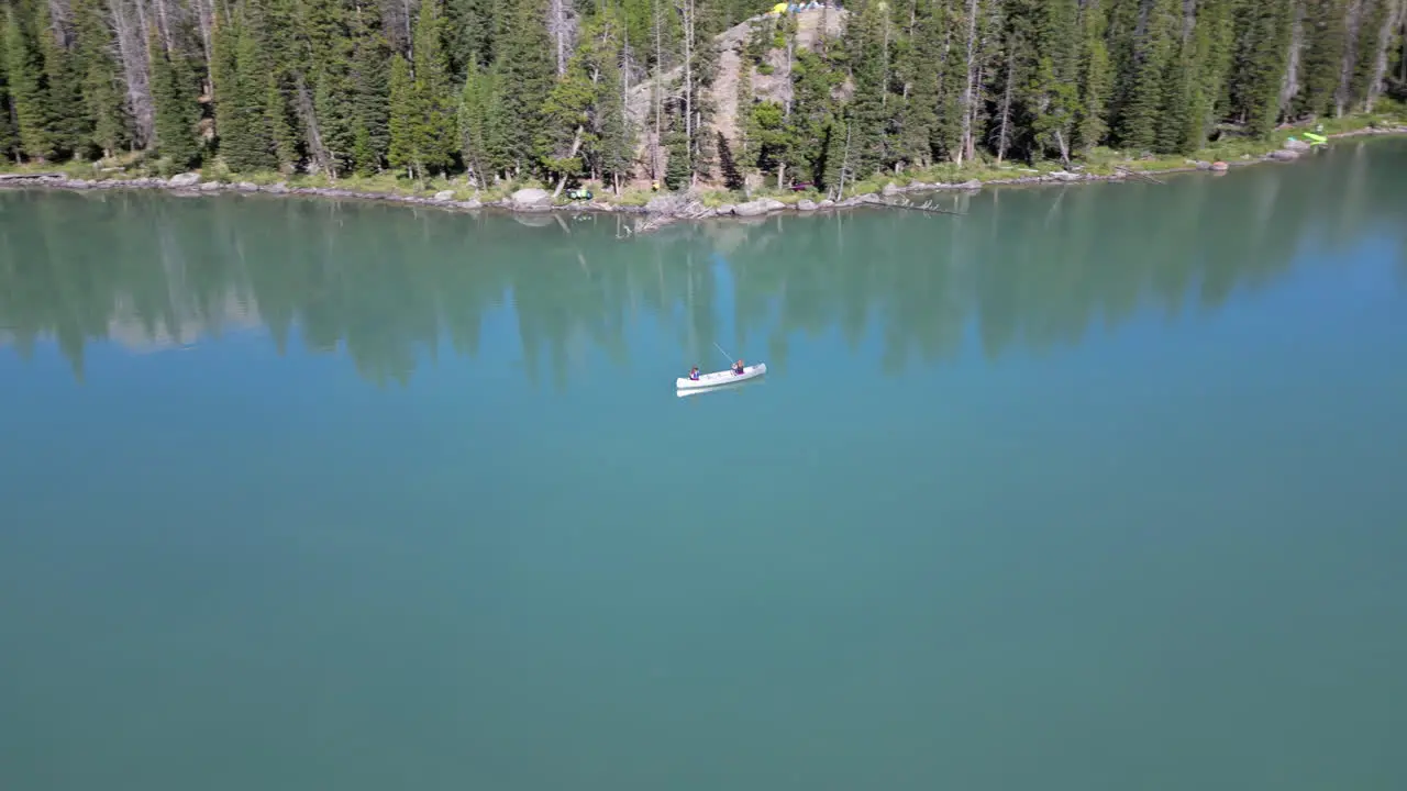 Canoeing Over Tranquil Water Of Green River Lakes In Wyoming