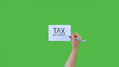 Woman Writing Tax Returns on Paper with Green Screen 03