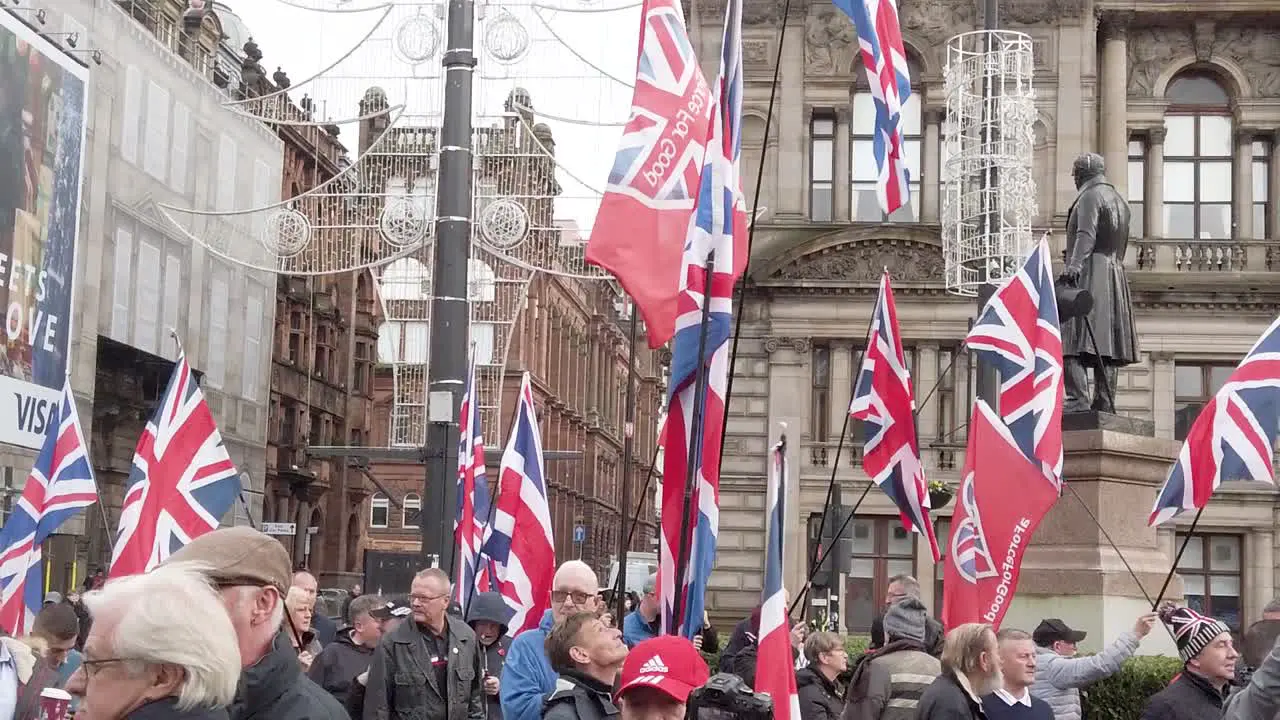 A slow-motion and close-up of people with British flags at a Scottish Independence rally