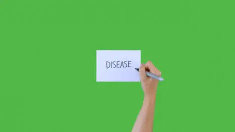 Woman Writing Disease on Paper with Green Screen