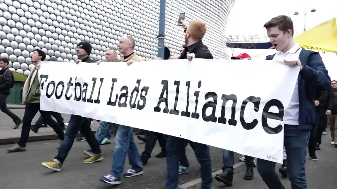 UK March 2018 Protestors march holding a banner of the far right group Football Lads Alliance in Birmingham