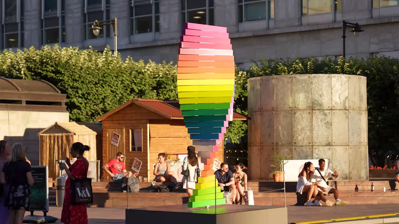 Canary Wharf London England June 2022 Pride tribute sculpture rotating by the Cabot Square fountain