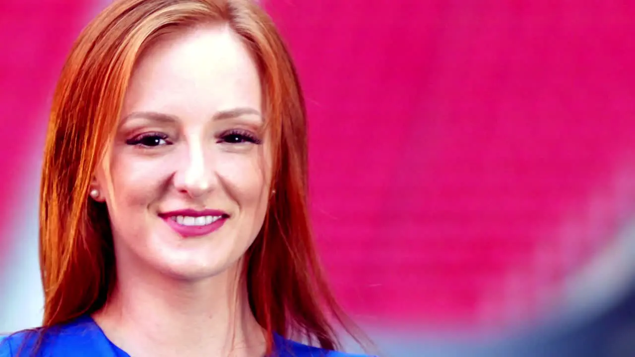 Cute model smiling to the camera in a soccer stadium on the background Slow-motion