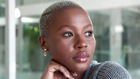 Professional black woman thinking while sitting