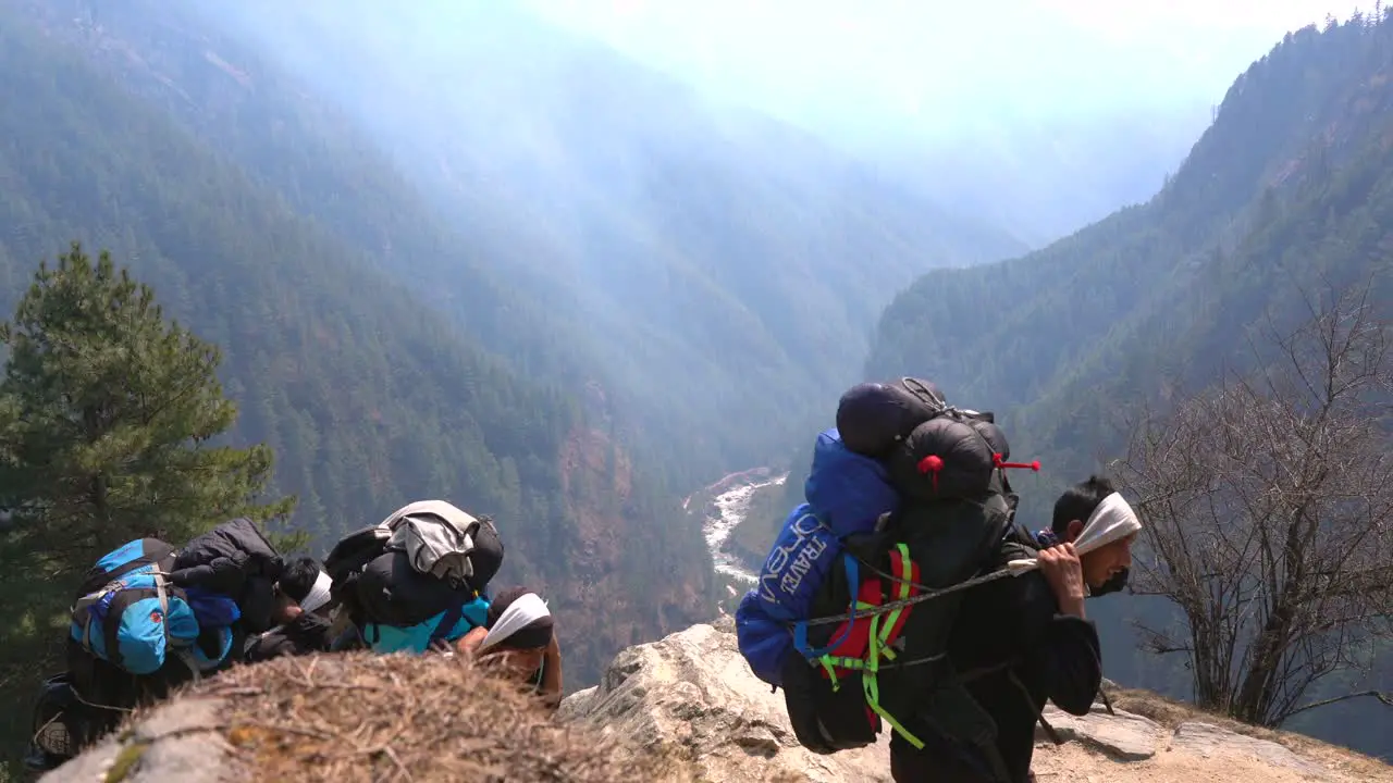 Namche Bazaar Nepal March 14 2022 Some porters carrying large loads of luggage to Namche Bazaar on the trek to Everest Base Camp