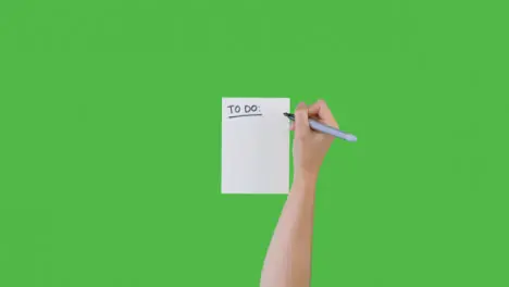 Woman Writing To Do on Paper with Green Screen