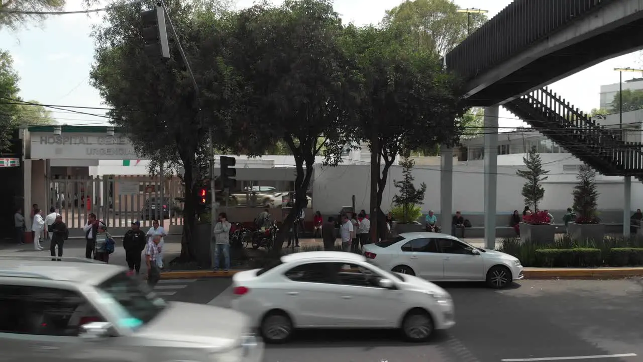 Cars driving outside a public hospital entrance in Mexico City