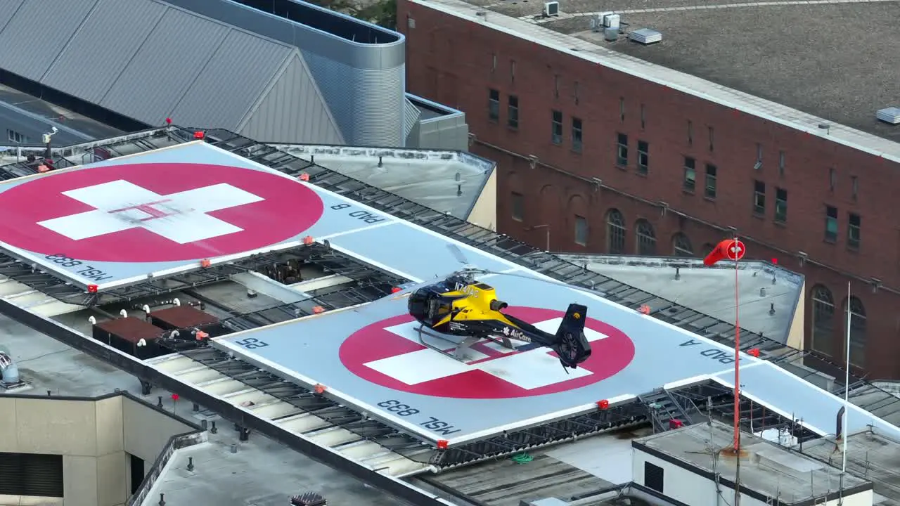 Air Care helicopter sitting on hospital helipad