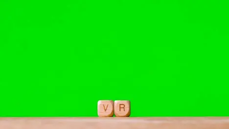 Business Concept Wooden Letter Cubes Or Dice Spelling VR Against Green Screen