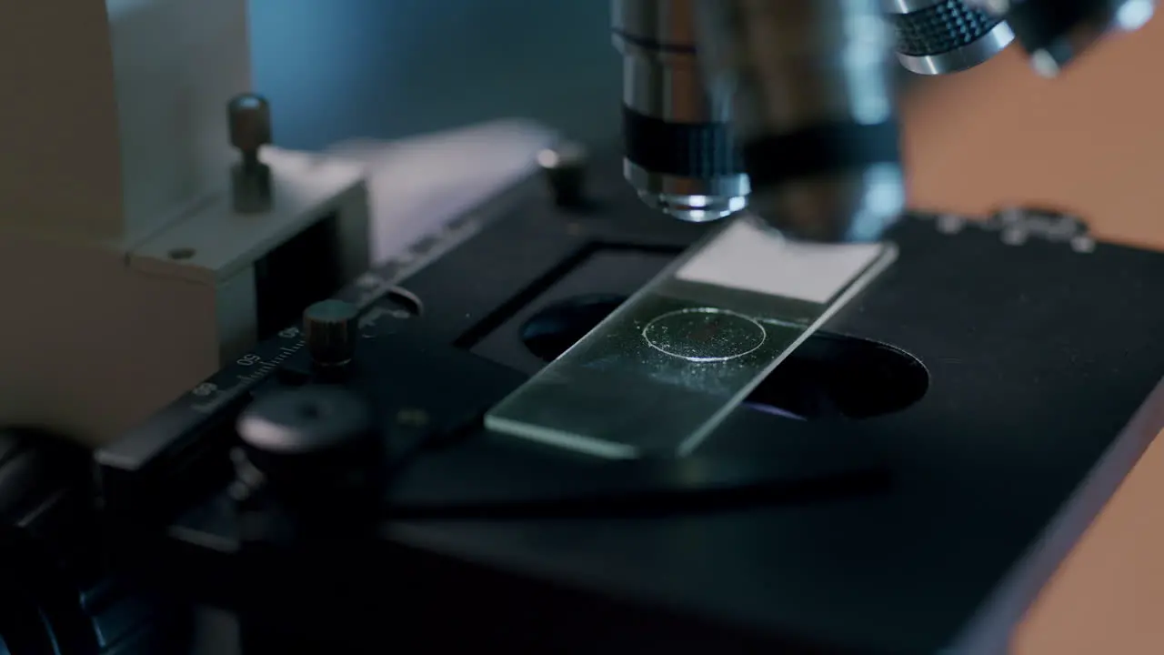 Young life scientist working with a professional microscope in the laboratory