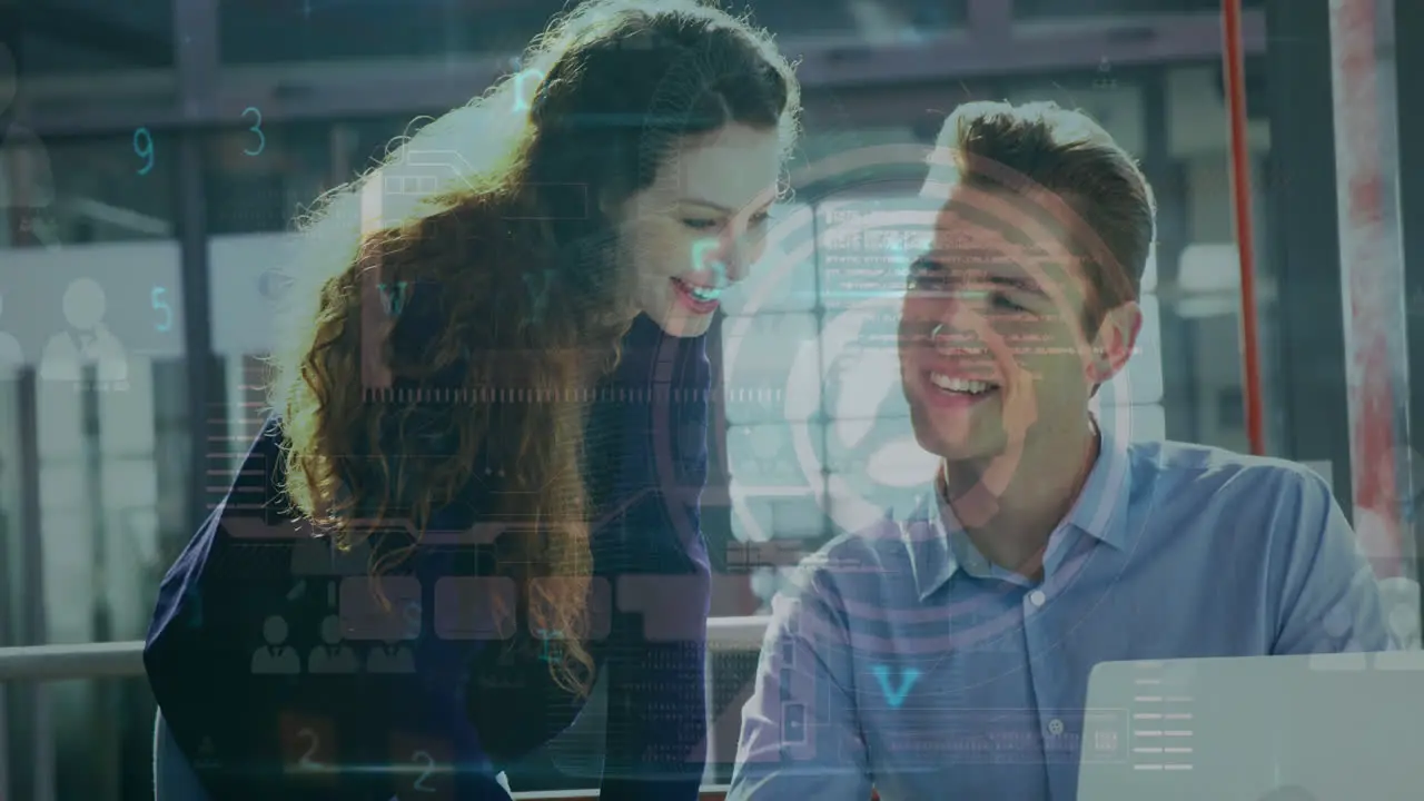 Animation of data processing on digital screen over happy caucasian female and male coworkers