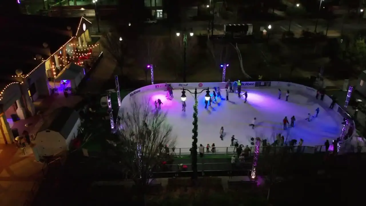 Christmas Ice Rink outdoor at night drone shot