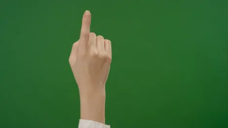 Female Finger making tap gestures on green screen