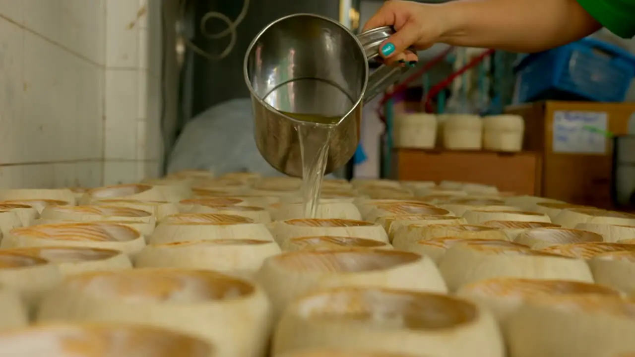 The process of making Coco Jelly a famous thai street food made by jelly poured into shells with shredded coconut