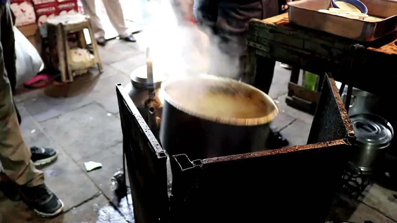 Vendor Boiling the Chai Tea in Old Delhi