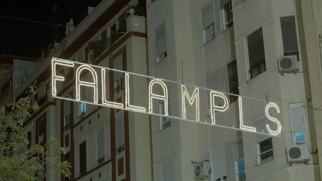 Night view of illuminated banner in celebration of Las Fallas Valencia