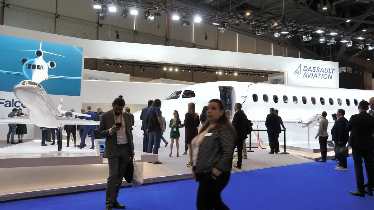 EBACE-attendees visiting the EBACE 2022 Dassault Falcon exhibit in Geneva