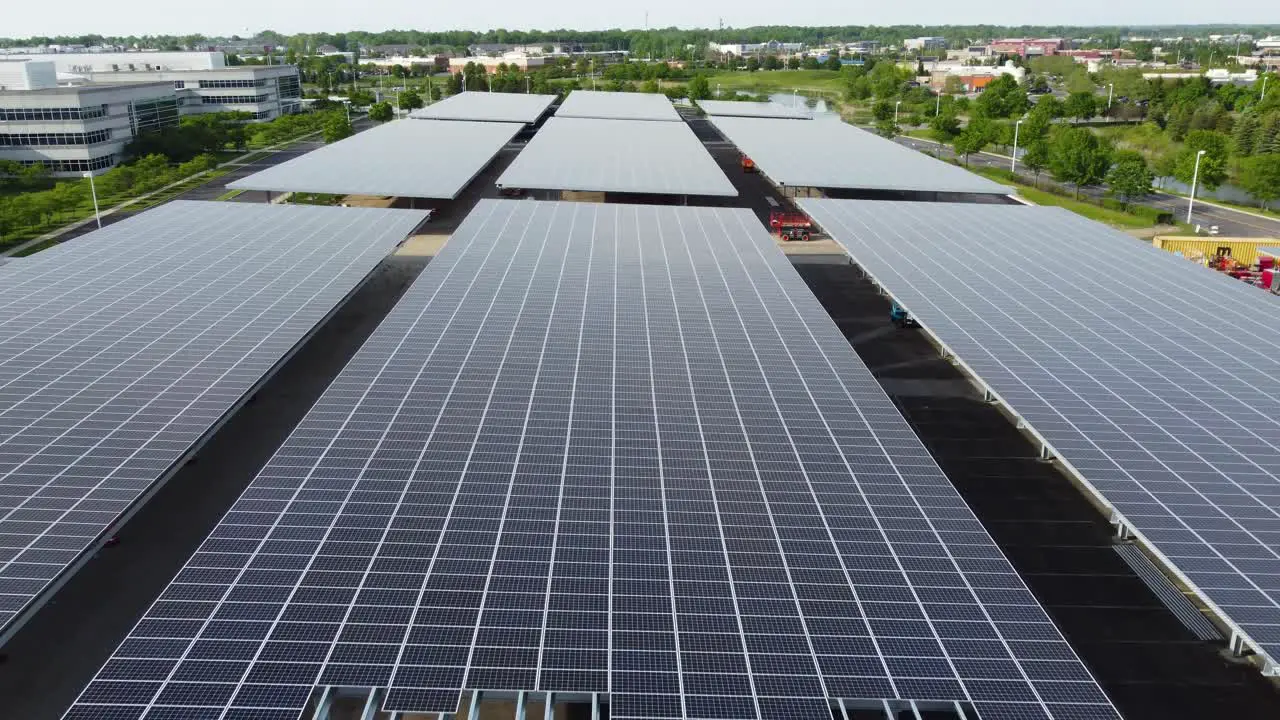 Solar panels installed in a corporate office complex parking lot and solar panels on the office complex buildings