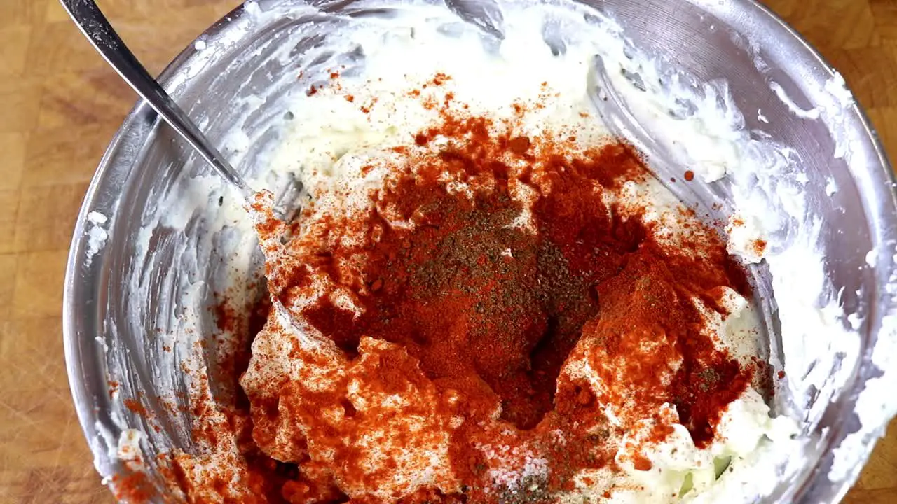 Sprinkling Chilly Powder Over Cottage Cheese Dip