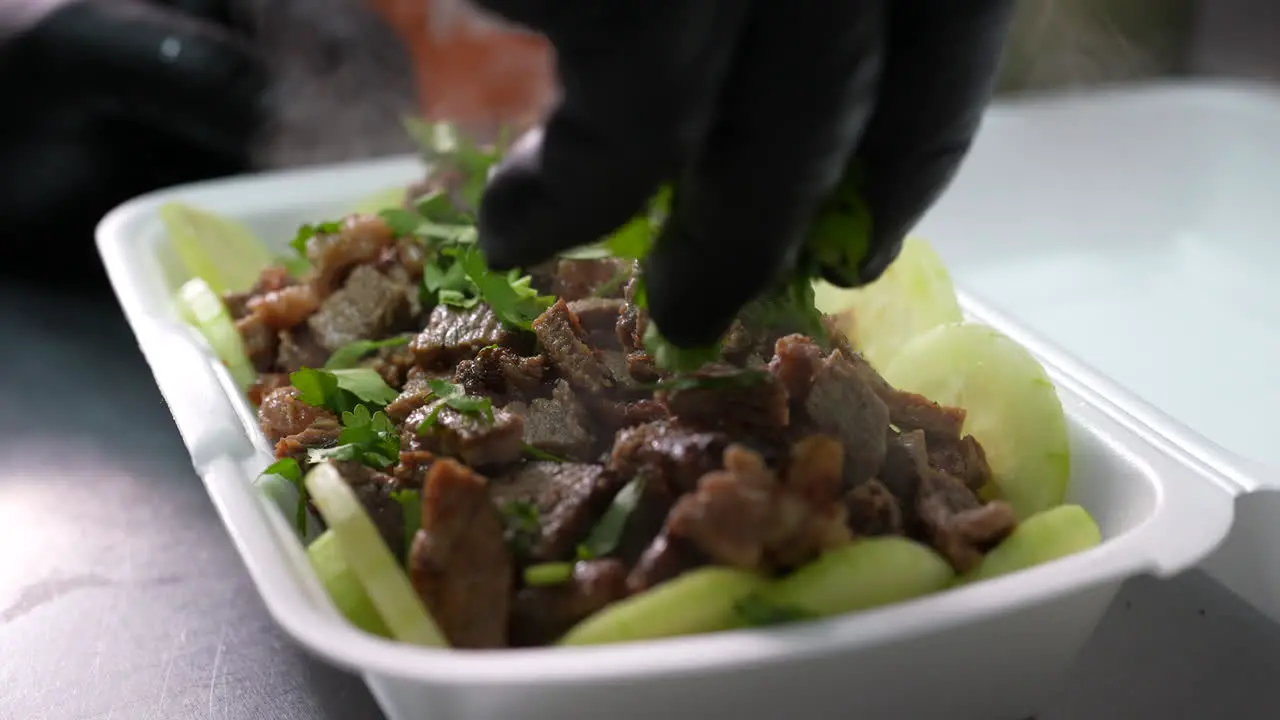 Keto bowl with grilled chopped steak cucumbers and cilantro food truck series