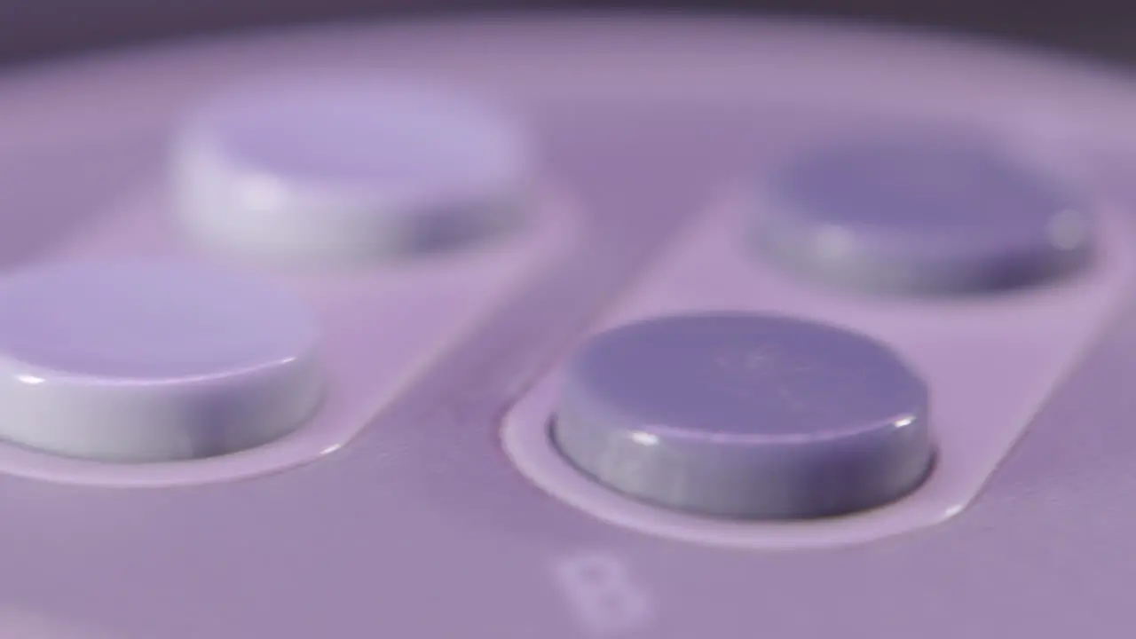 Top of Vintage Super Nintendo Controller in Purple Light SLIDE LEFT