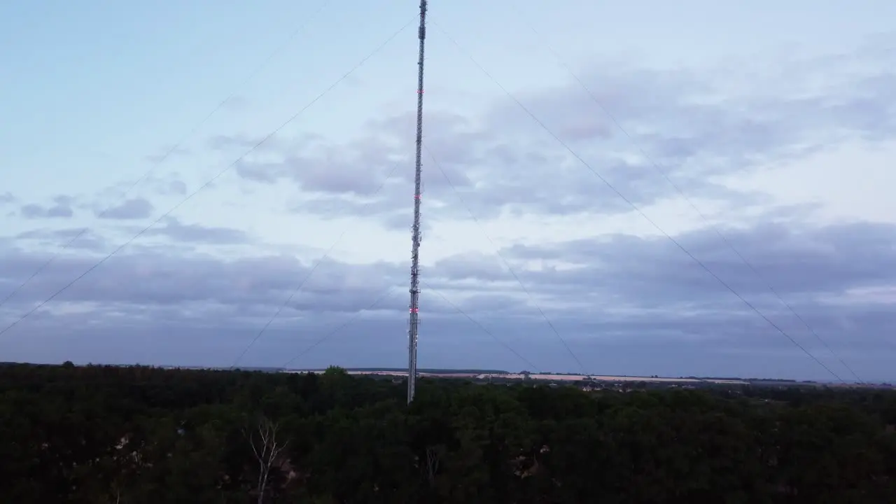 Low to high drone aerial shot of a radio tower in Deepdale Sandy Bedfordshire Uk