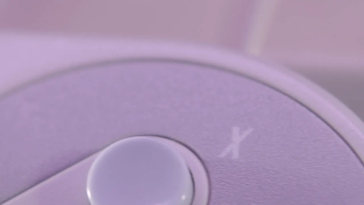 Logo on Vintage Super Nintendo Controller in Purple Light SLIDE LEFT