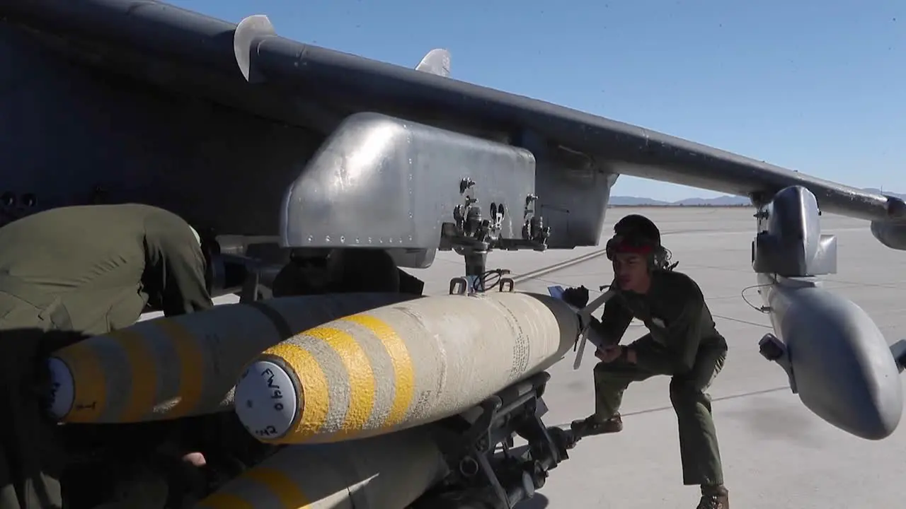 Us Marine Corps Ordnance Technicians Load Bombs Onto A Av-8B Harrier Ii Air Station Yuma Arizona