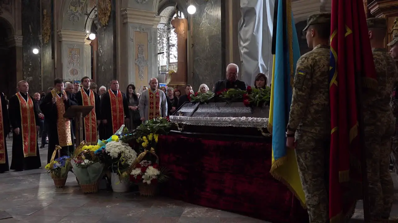 A Catholic Priest Administers Last Rites Over The Coffin Of A Dead Ukrainian Soldier During A Funeral Service In Lviv Ukraine