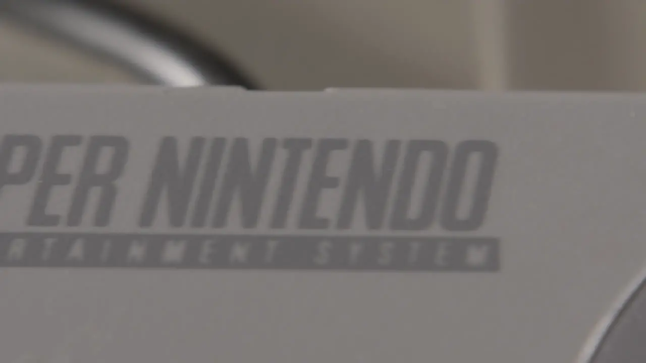 Logo on Vintage Super Nintendo Controller SLIDE RIGHT