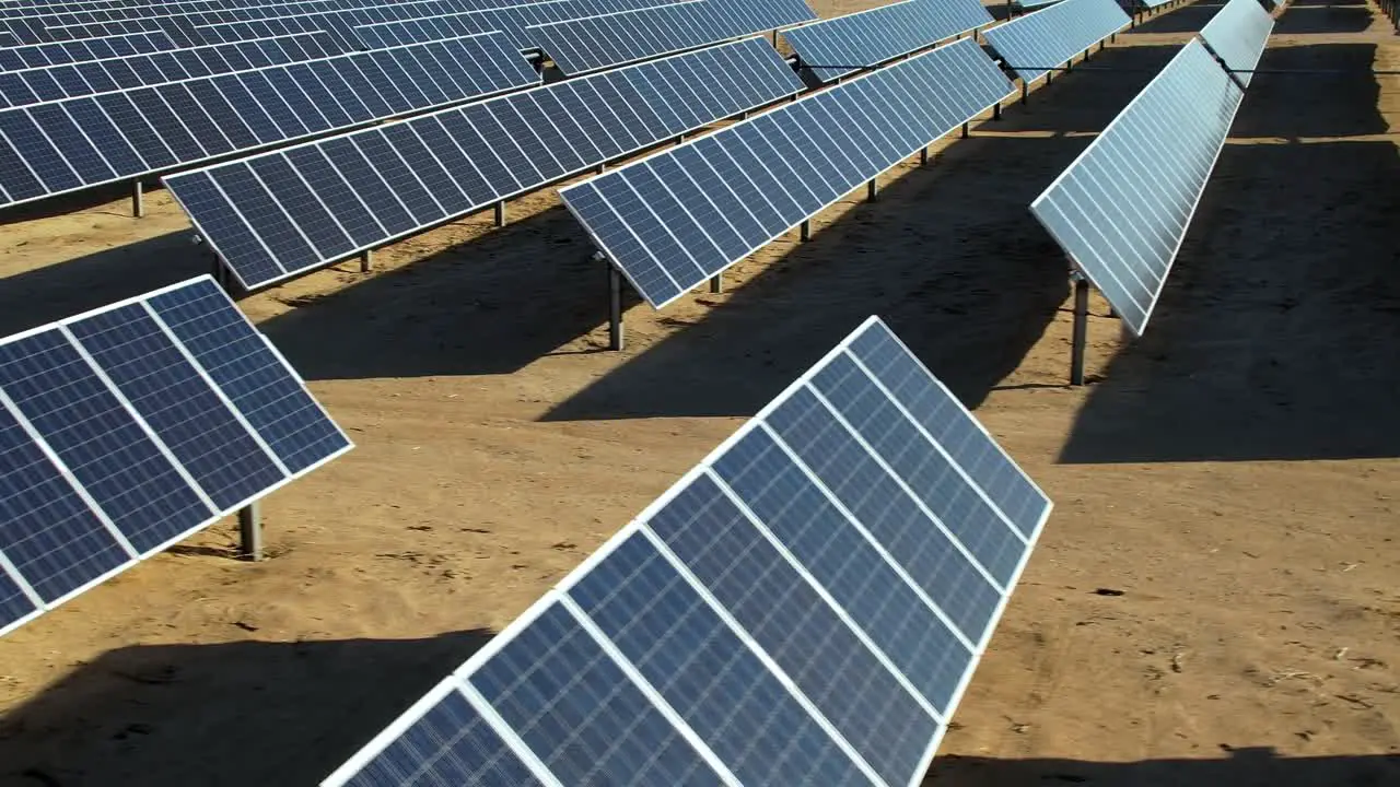 Rows of solar panels in Mojave desert field green energy aerial view environmental concept