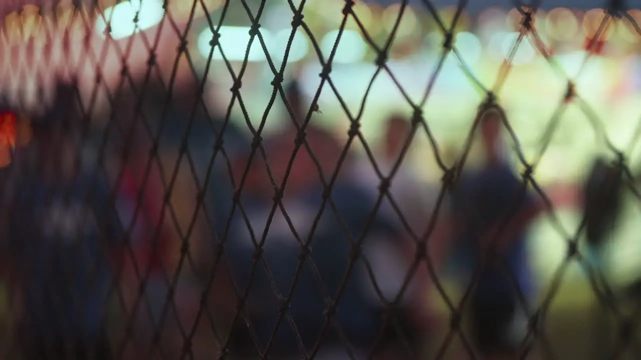 Young boy in blurred background playing speed pitch game at carnival Slow Motion