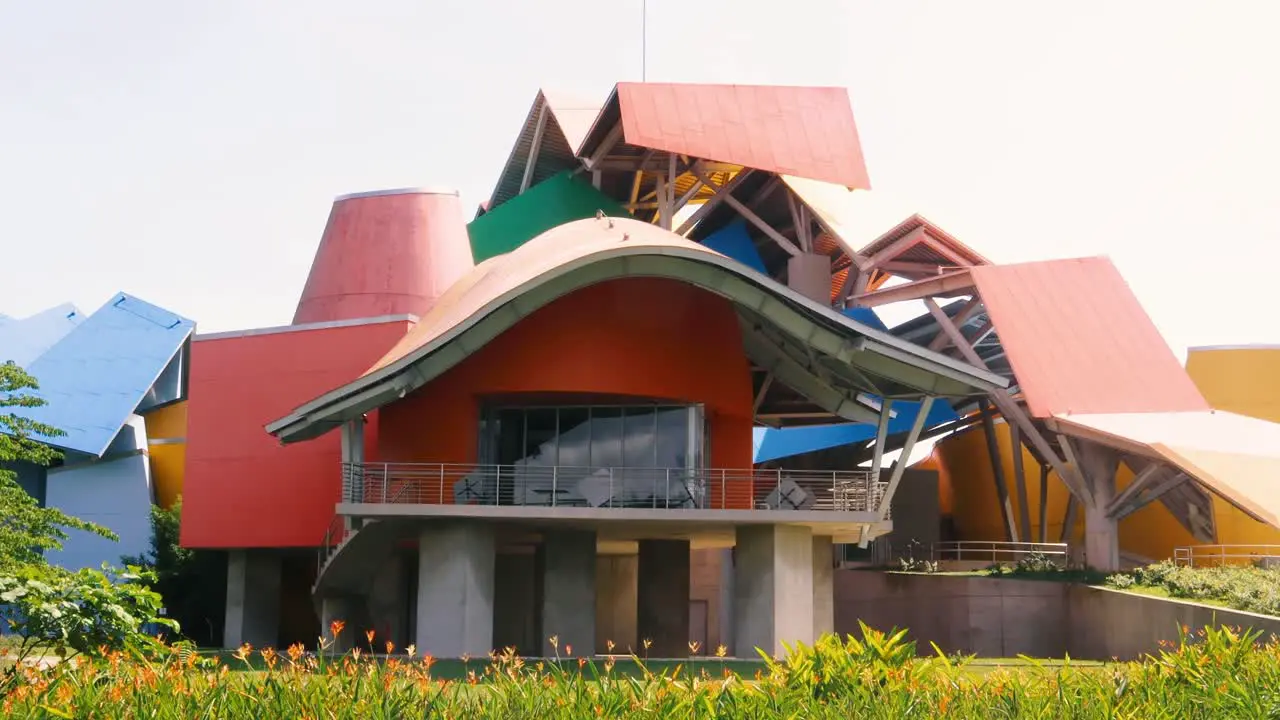 Biodiveristy museum Biomuseo handheld 4k shot during the day in summer surrounded by the abundant green vegetation of Panama City's Causeay of Amador