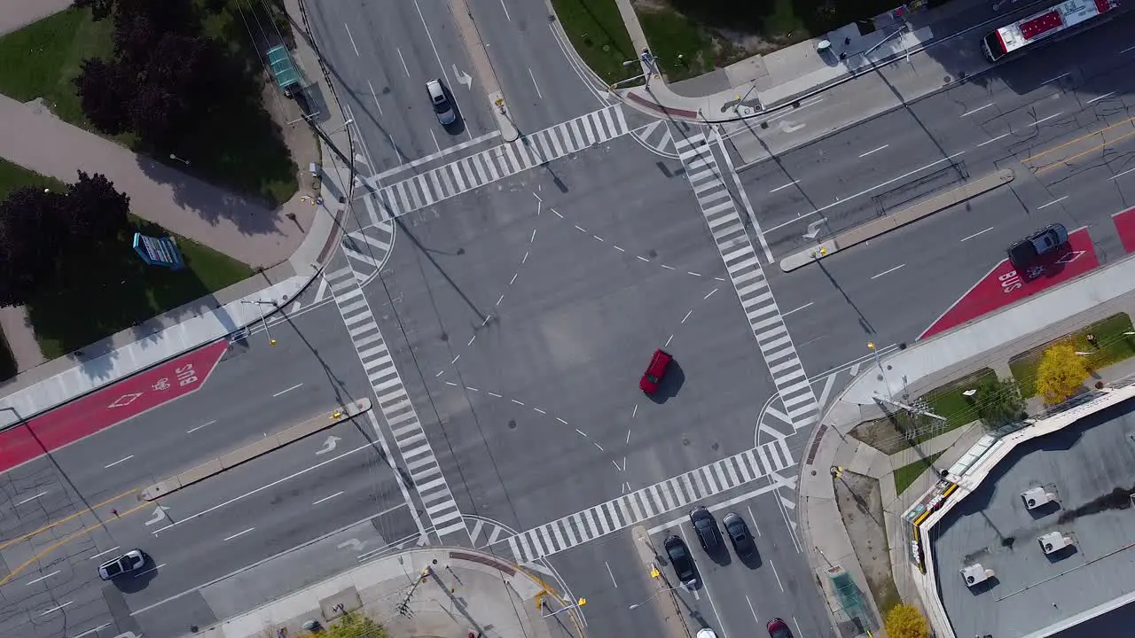 Bus lanes with buses driving through busy city intersection with cars and traffic