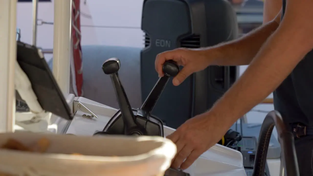 Pulling the gass handle from a Catamaran sailboat