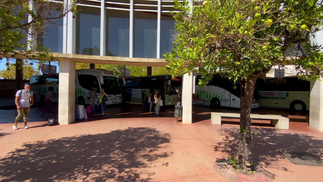 People waiting for a bus on main bus station in Huelva Spain