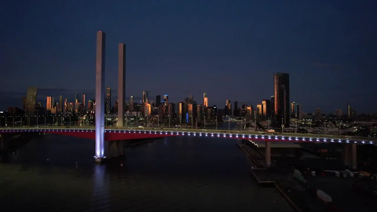 Golden City Melbourne aerial sideways Bolte bridge in blue lights