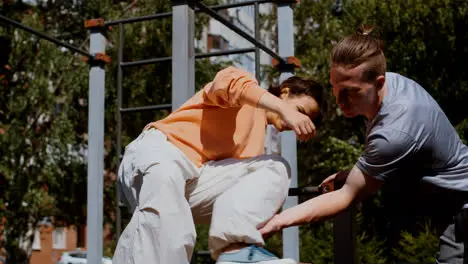 Man and woman training parkour