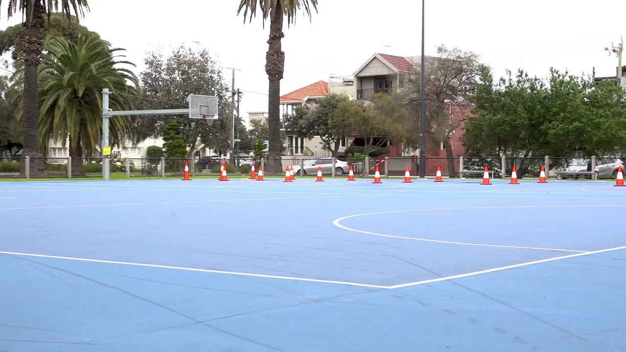 4K shot of temporarily closed outdoor basketball court during pandemic lockdown