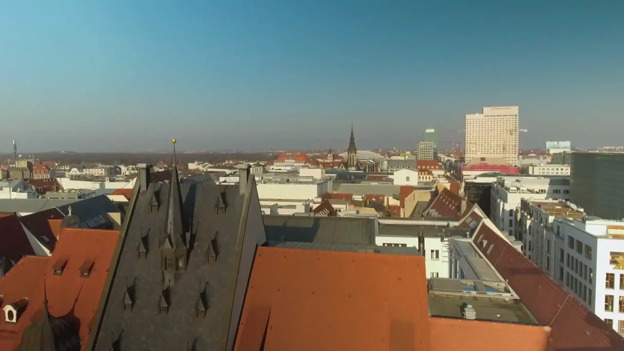 4K Crane Aerial Drone Shot over the city of Leipzig Germany in the afternoon with blue sky